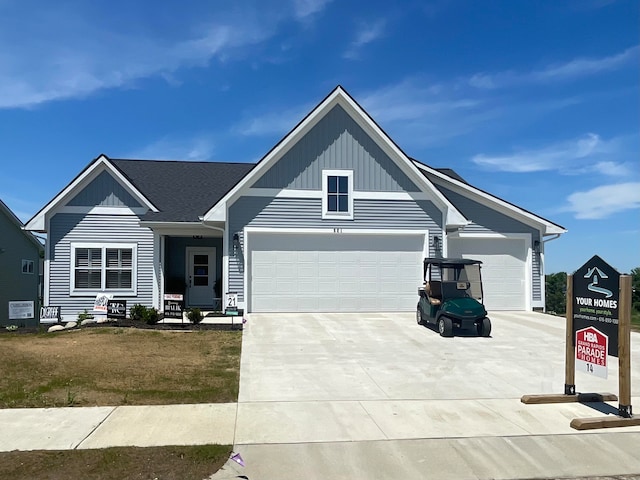 view of front of house featuring a front yard and a garage