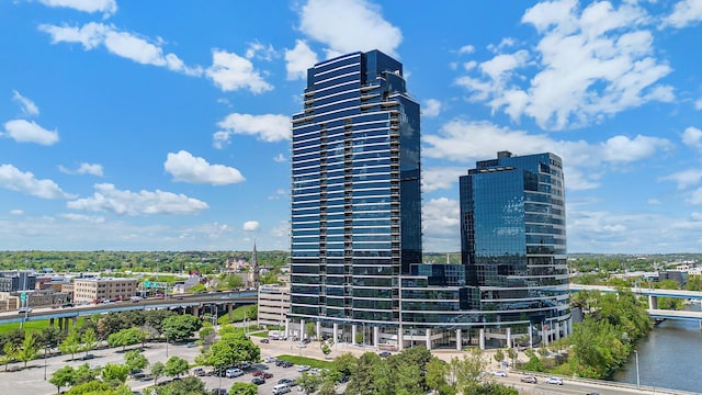 view of property with a city view and a water view