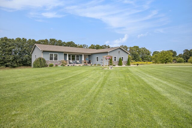 ranch-style home featuring a front yard