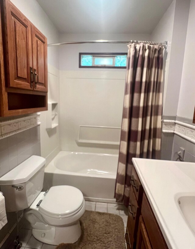 full bathroom with vanity, toilet, tile patterned floors, and shower / bath combo