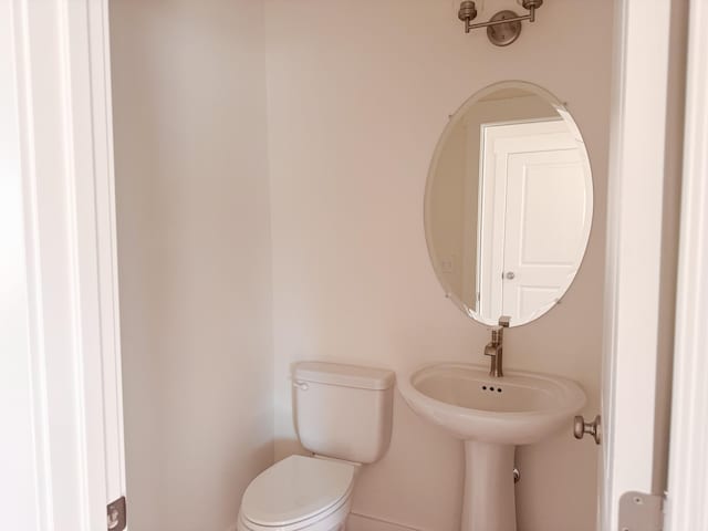 bathroom featuring a sink and toilet