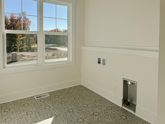 laundry room featuring washer hookup, laundry area, visible vents, and baseboards