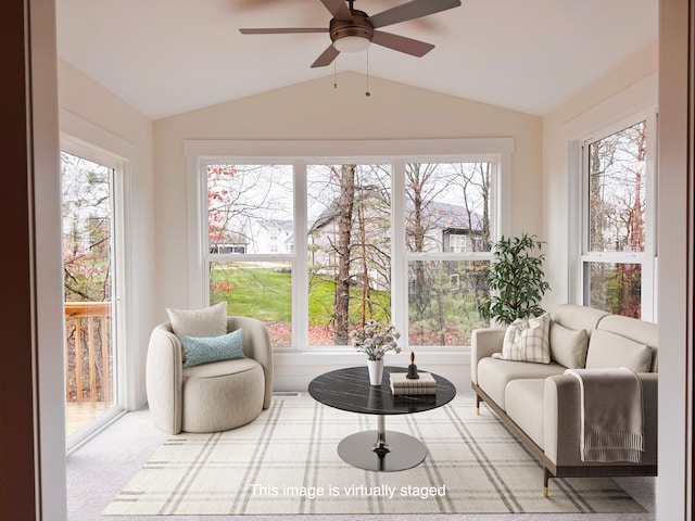 sunroom / solarium with visible vents, vaulted ceiling, and a ceiling fan