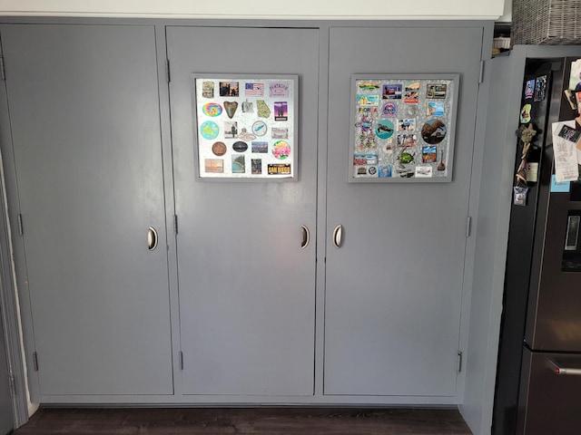 interior space with fridge and dark hardwood / wood-style flooring