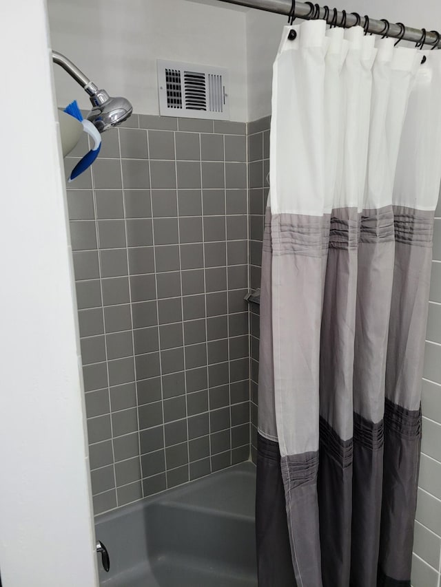 bathroom featuring shower / bath combination with curtain