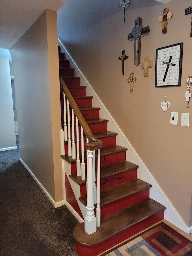 staircase with carpet floors