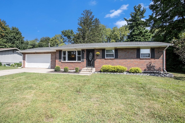 single story home featuring a garage and a front lawn