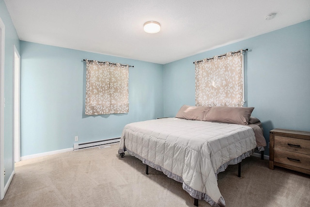 carpeted bedroom with baseboard heating