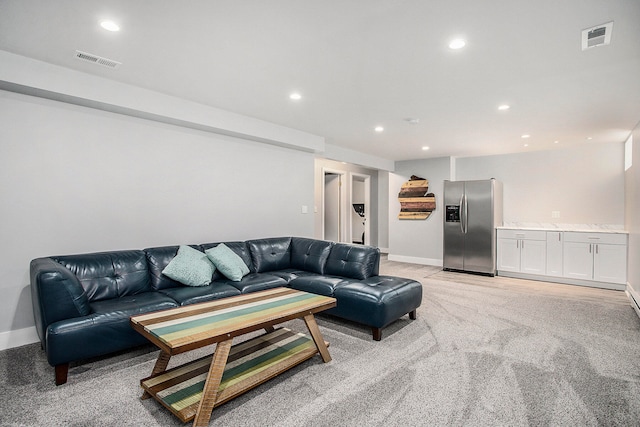 living room featuring light carpet