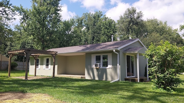 exterior space featuring a front yard and a pergola