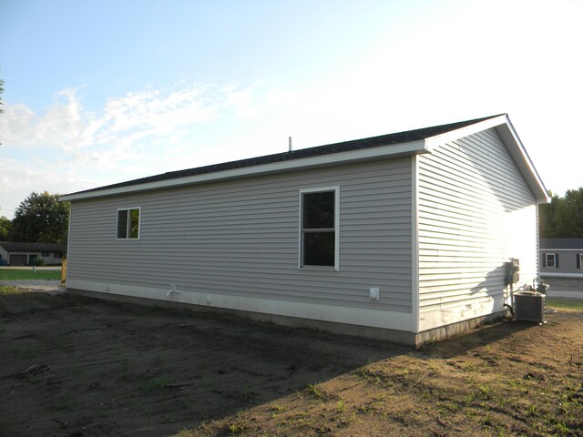 view of side of property featuring cooling unit