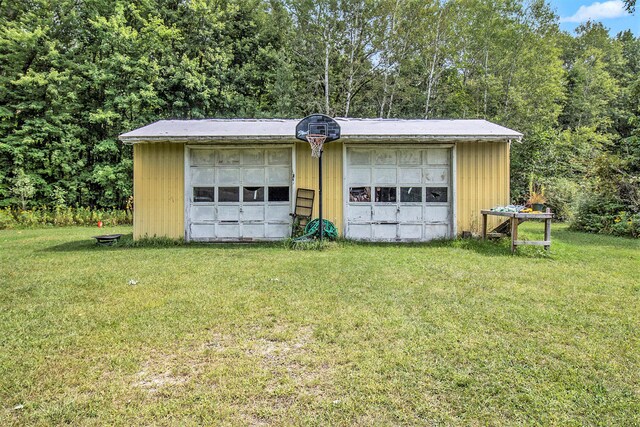 garage featuring a yard