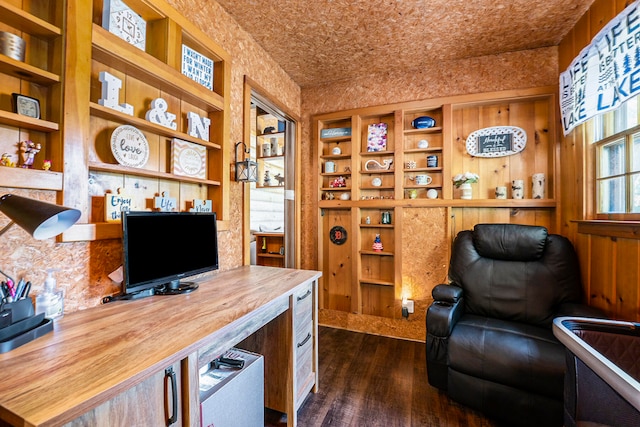 office space with dark wood-type flooring and built in features