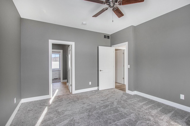 unfurnished bedroom featuring ceiling fan and light carpet