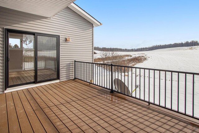 view of snow covered deck