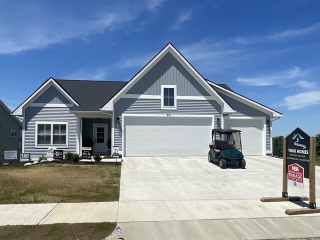 view of front of home with a garage and a front yard