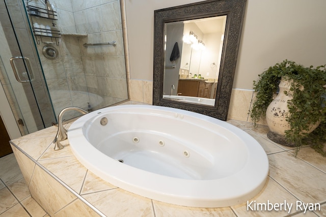 bathroom featuring vanity and separate shower and tub