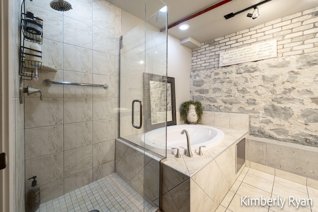 bathroom featuring independent shower and bath and tile patterned flooring