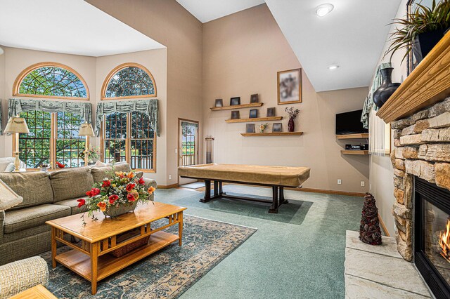 carpeted living room featuring a fireplace and billiards