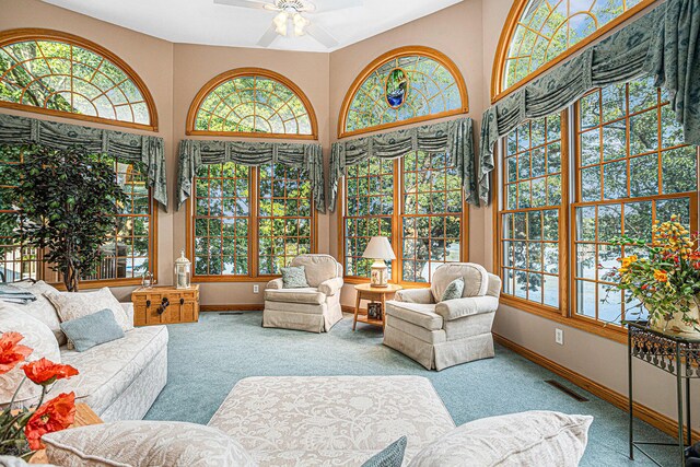 sunroom / solarium with ceiling fan