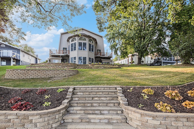 back of house with a yard