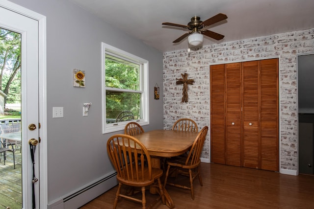 dining area featuring ceiling fan, dark hardwood / wood-style flooring, and baseboard heating