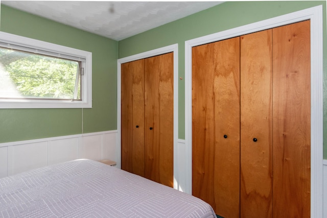 bedroom featuring two closets