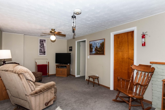 carpeted living room with ceiling fan and a textured ceiling