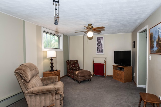 sitting room featuring baseboard heating, ceiling fan, carpet, and a textured ceiling