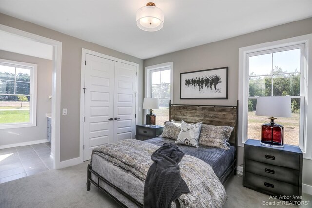 carpeted bedroom with a closet