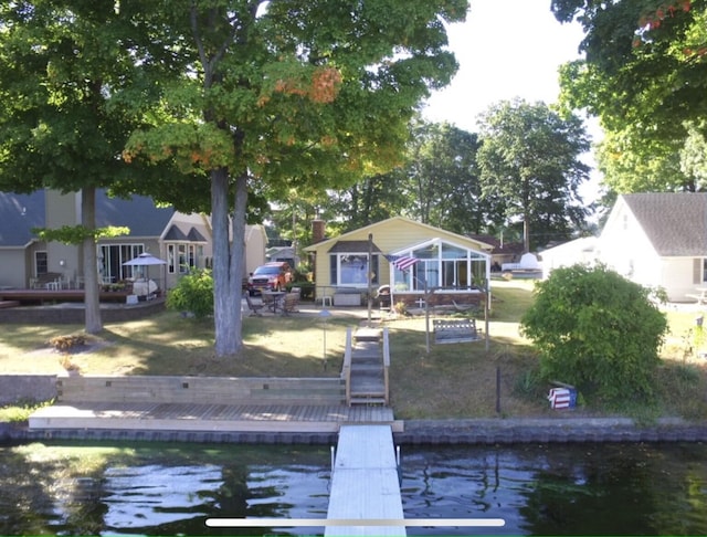 back of house with a water view