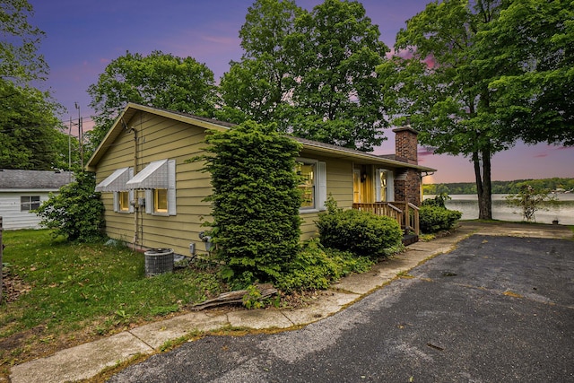 5540 Cozy Point Dr, Newaygo, MI 49337 - view of front of house with a chimney