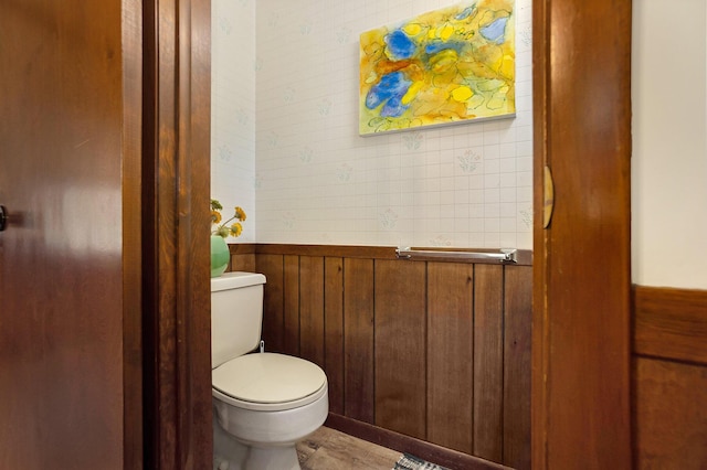 5540 Cozy Point Dr, Newaygo, MI 49337 - bathroom with toilet, wainscoting, and wood walls