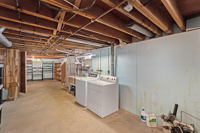 5540 Cozy Point Dr, Newaygo, MI 49337 - unfinished below grade area with washer and clothes dryer and a sink