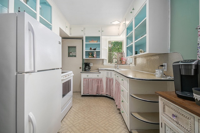 kitchen featuring wood counters, white appliances, sink, and white cabinets