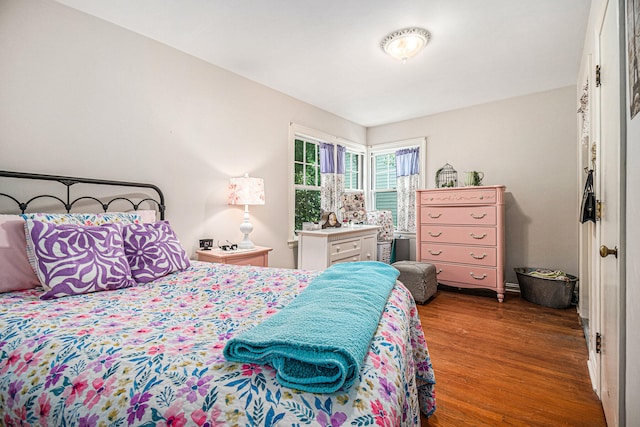 bedroom featuring dark hardwood / wood-style flooring