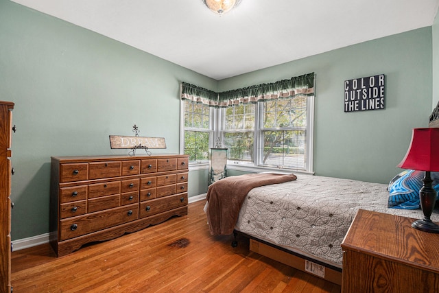 bedroom with wood-type flooring