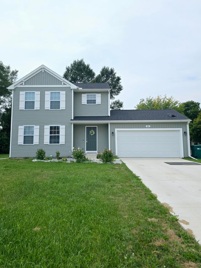 front of property with a front lawn and a garage