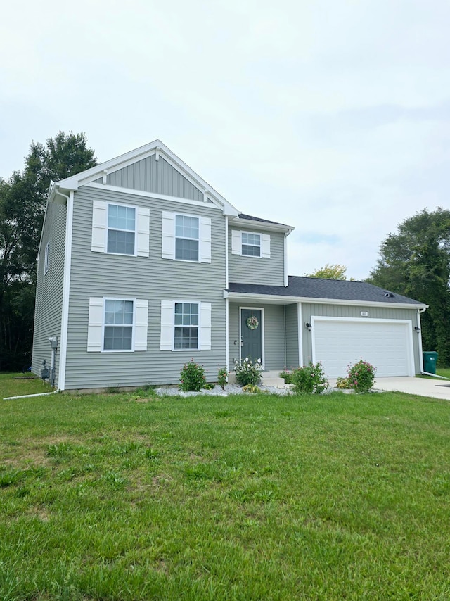 view of front of home with a front yard and a garage