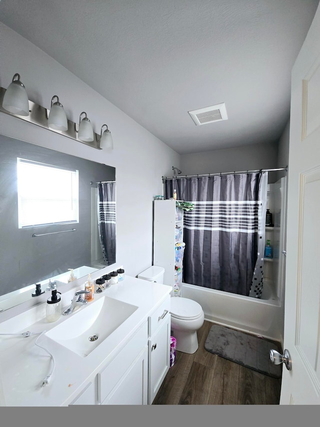 full bathroom with vanity, toilet, shower / tub combo, and wood-type flooring