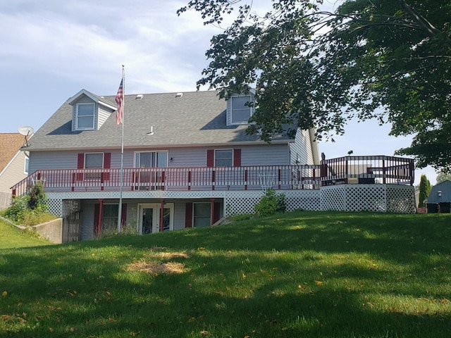 rear view of property featuring a yard and a deck