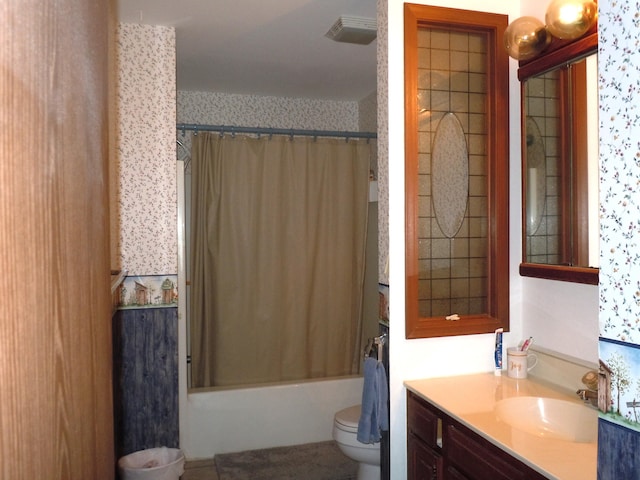 full bathroom featuring vanity, toilet, and shower / bath combo with shower curtain