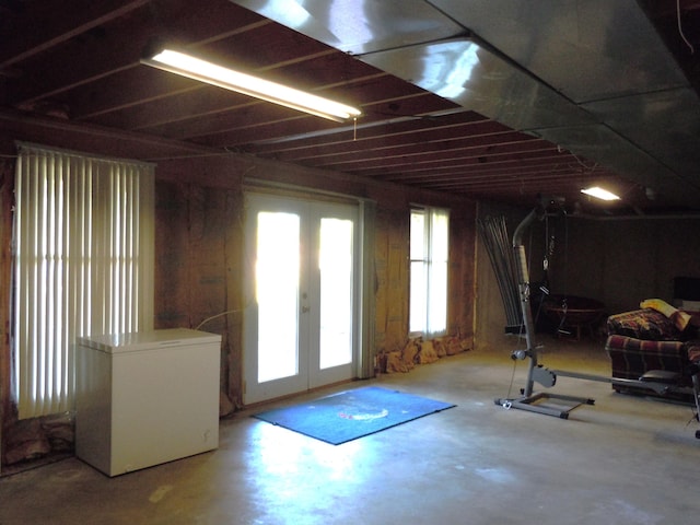 interior space with fridge and french doors