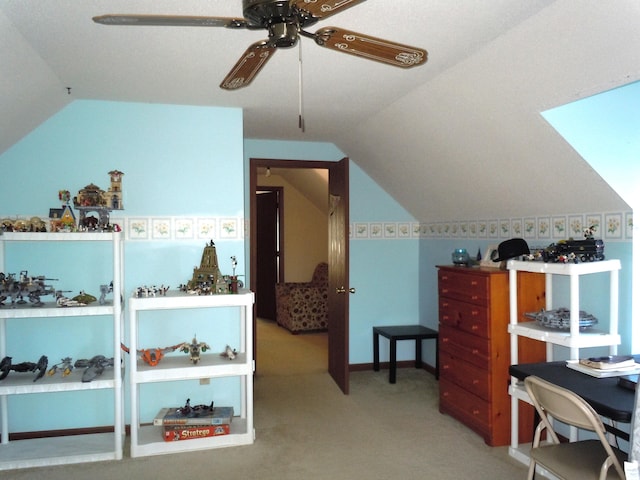 bedroom featuring lofted ceiling, light colored carpet, and ceiling fan