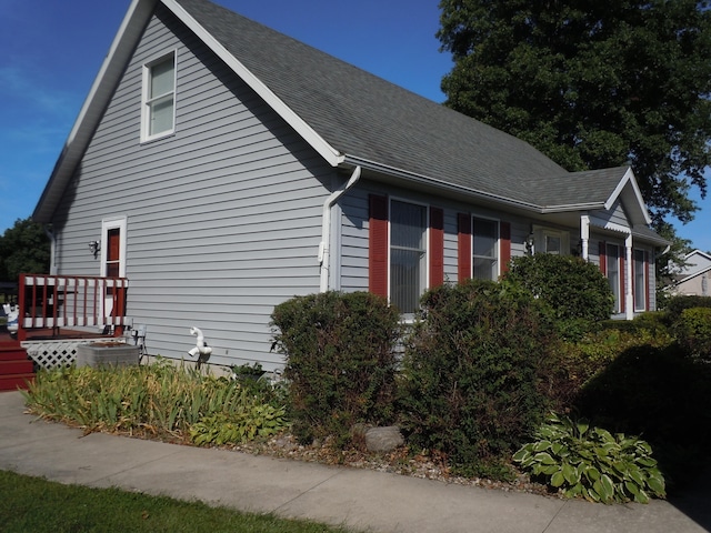 view of side of home featuring a deck