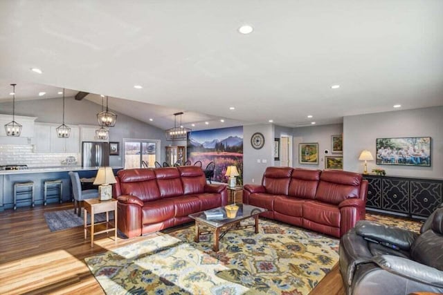 living room with lofted ceiling and hardwood / wood-style floors