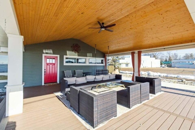 deck with an outdoor living space and ceiling fan