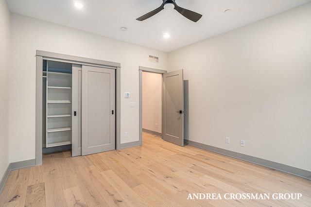 unfurnished bedroom with a closet, ceiling fan, and light wood-type flooring