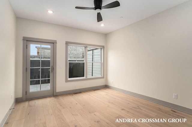 empty room featuring ceiling fan and light wood-type flooring