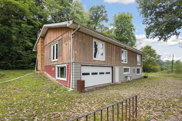 view of side of property with a garage